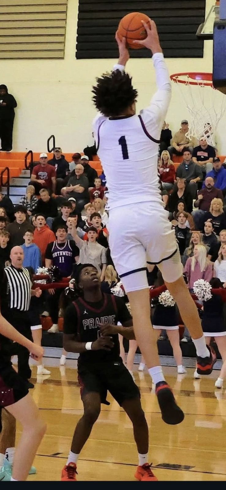 Jaden Ghoreishi rising for a dunk in a high school game